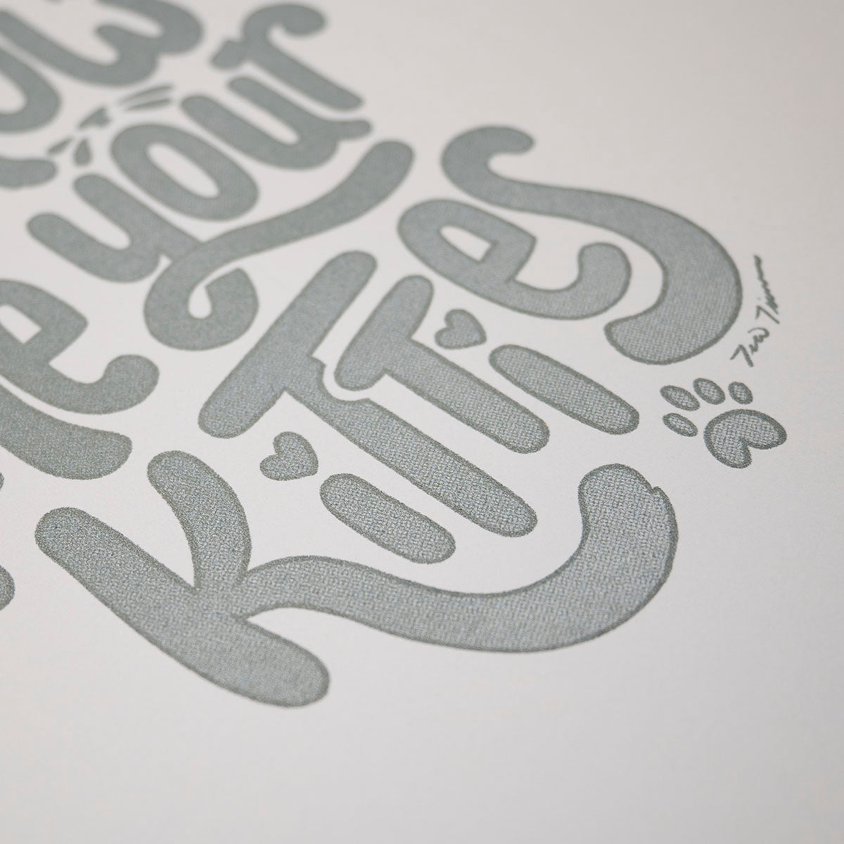 Angled image of the detail on a hand lettered and illustrative "Show me your kitties" print.