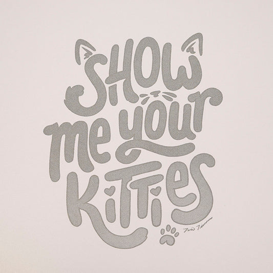 Hand lettered and illustrative "Show me your kitties" with cat ears, whiskers, and a paw print.