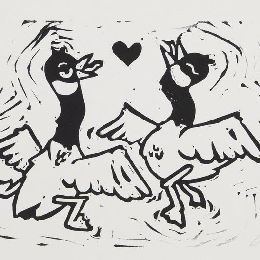 Close up of an illustration of two silly, dancing geese with a heart between them.