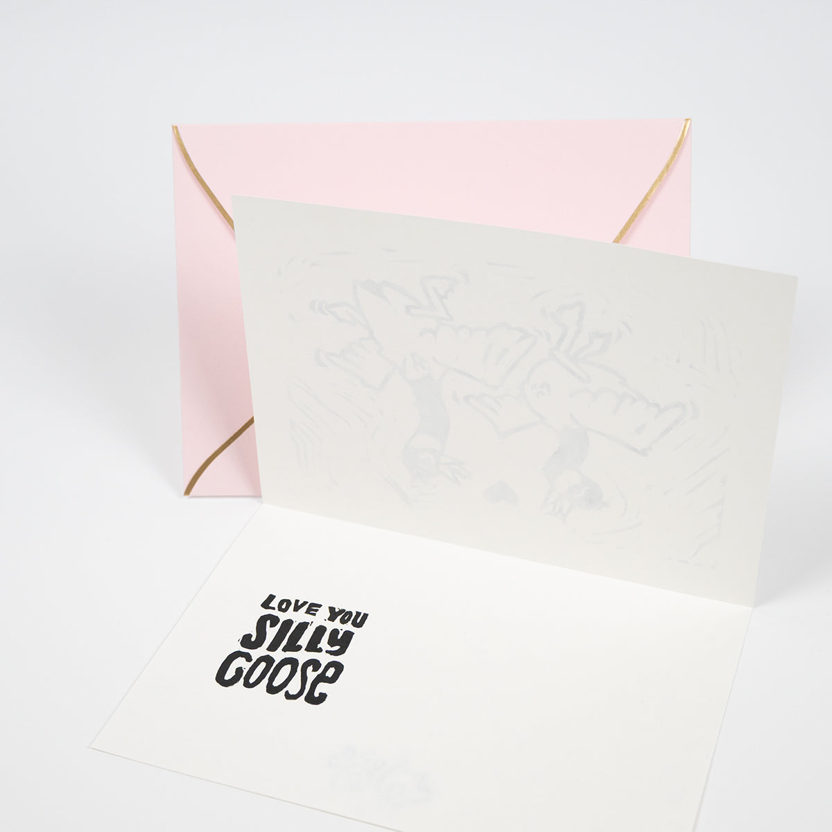 White greeting card interior with "Love You Silly Goose" hand lettered on the left-hand side.