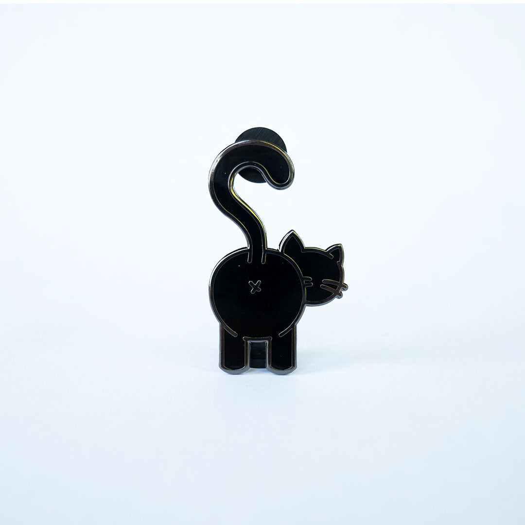 Black cat butt pin with black nickel metal on white.