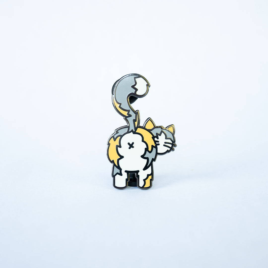 Light calico cat butt pin on white background.