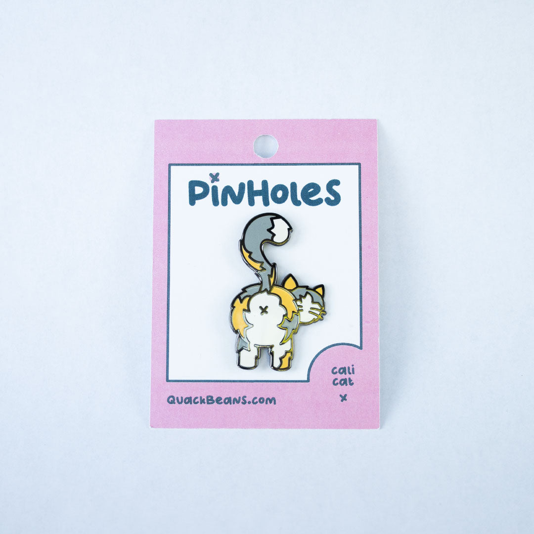 Light calico cat butt pin on a pink Pinholes hang tag card