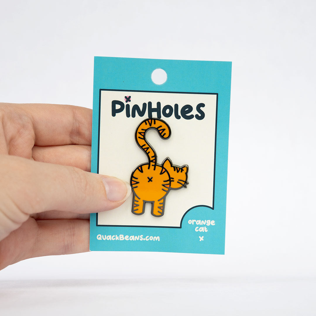 Pinholes | Orange Tabby Cat