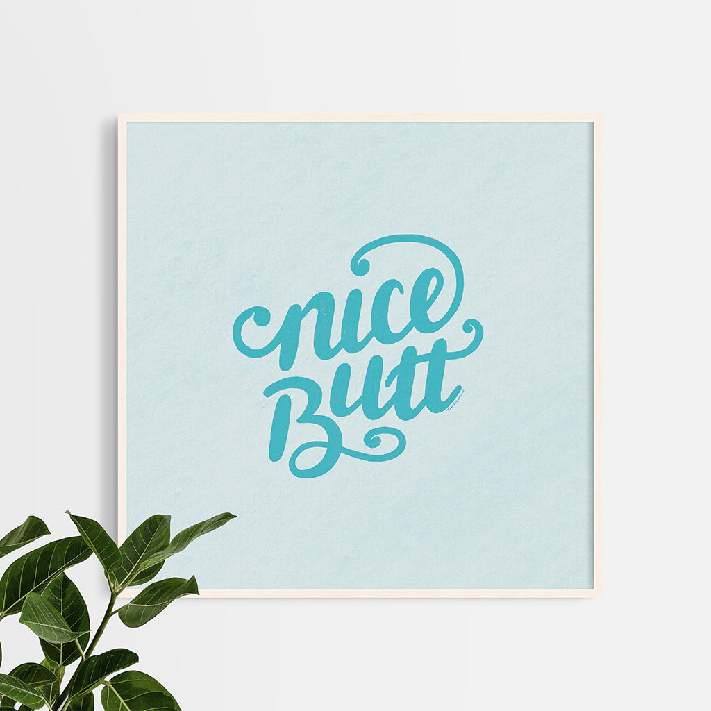 12"x12" art print with hand-lettered words "nice butt" in a frame with no mat.